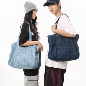 Large denim tote bag in light and dark blue colors for casual commuting and daily use