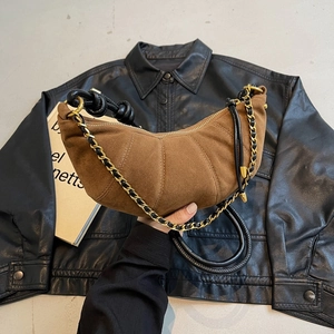Caramel quilted suede crescent bag with gold chain strap and hobo style design