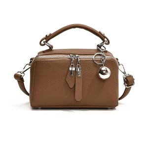Brown leather Boston handbag with silver hardware and spherical charm for women