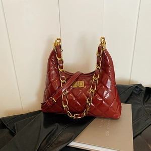 Deep red quilted patent leather shoulder bag with gold chain and turn-lock closure