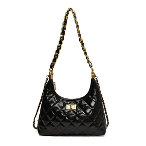 Glossy black quilted leather hobo bag with gold chain strap and turn-lock closure