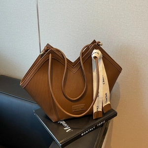 Dark brown pleated tote bag with large capacity and stylish ribbon pendant detail