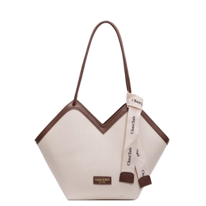 Large beige textured tote bag with V-shaped opening and brown straps for daily commute