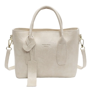 Sac à main minimaliste en cuir blanc crème avec poignées rondes et bandoulière amovible