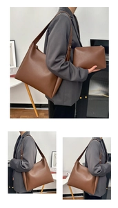 Detail view of large caramel brown leather tote bag with matching pouch and strap
