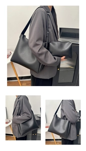 Detail view of large black tote bag and matching pouch in soft matte synthetic leather
