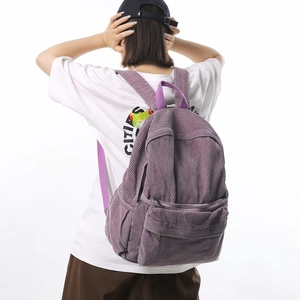 Minimalist purple corduroy backpack for women featuring large capacity and soft texture