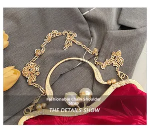 Detail of red velvet handbag with pearl clasp and diamond-studded metal handle