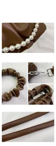 Close-up of brown pleated handbag showing pearl chain, silver hardware, and leather texture