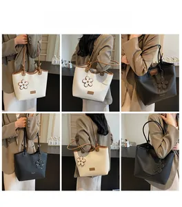 Detailed views of stylish tote bag with floral pendant and adjustable shoulder straps