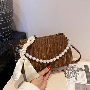 Brown pleated shoulder bag with large pearl handle and silver chain strap details