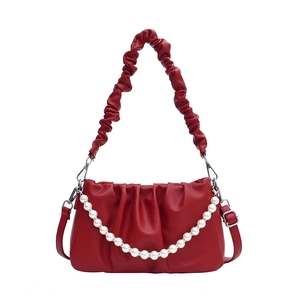 Chic red pleated cloud handbag with white pearls and adjustable shoulder strap