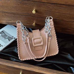 Pink shoulder bucket bag with woven edges and a large silver buckle detail