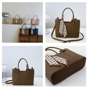Detail of vintage brown tote bags with litchi texture and stylish silk scarf accents