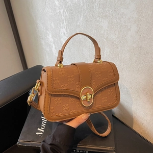 Brown textured plaid pattern crossbody bag with gold knob lock and stylish top handle