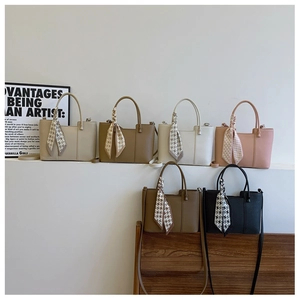 Detail view of stylish tote bags in six colors with decorative star print scarves