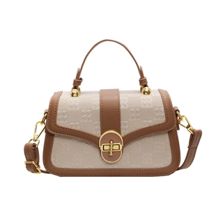 Retro cream plaid handbag with brown leather trim and gold twist lock in front view