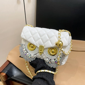 White quilted leather owl shoulder bag with crystal embellishments and gold chain strap