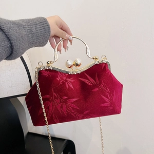 Vintage burgundy velvet handbag with bamboo pattern, pearl clasp and gold chain handle