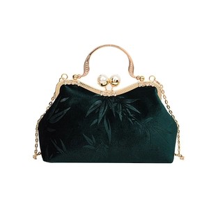 Retro emerald green velvet handbag with bamboo leaf embossing and pearl clasp closure