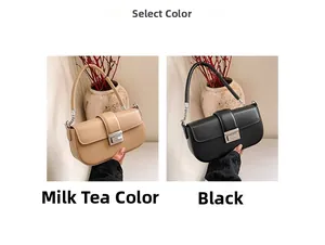 Detail view of stylish half-moon bags in beige and black with silver swivel locks