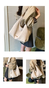 Detail of matte beige bucket bag showing soft texture and high-quality metal plaque