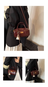Burgundy Boston handbag detail, stylish leather crossbody purse for women daily commute use.