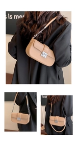 Detail of minimalist beige handbag showing silver metal lock and chain strap