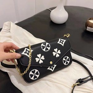 Retro black lychee grain leather crossbody bag with white floral print and gold chain