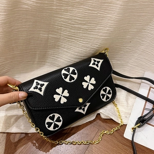Chic black litchi texture leather crossbody bag with white clover patterns and gold chain
