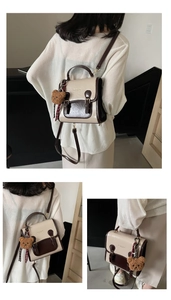 Detail view of contrast vintage small square bag with cute brown plush bear charm