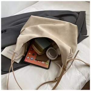 Spacious beige matte tote bag showing large capacity with tablet and daily essentials