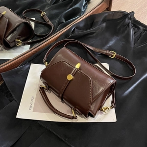 Retro dark brown leather Boston handbag with brass studs and adjustable shoulder strap