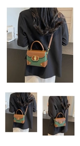 Detail of green woven texture and brown leather trim on retro crossbody box bag