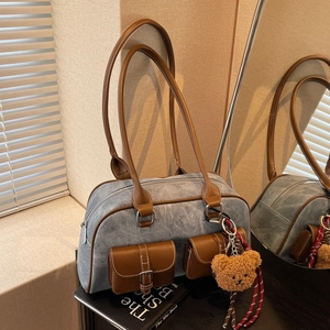 Retro Boston tote bag in dusty blue fabric with brown leather straps and plush bear charm