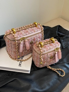 Pink tweed crossbody chain bag with camellia flower detail and gold metal hardware