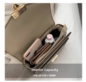 Interior view showing the capacity of the light khaki leather crossbody flap bag