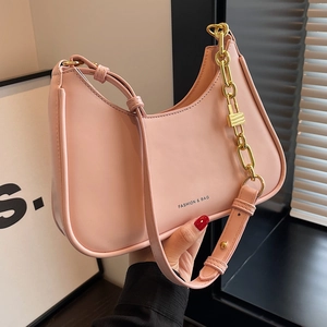 Pink crescent hobo bag with gold chain and Fashion & Bag lettering on high-quality leather