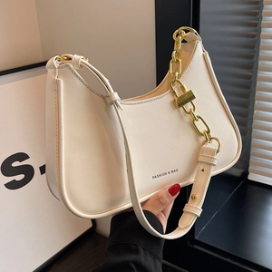 Chic beige crescent underarm bag with gold chunky chain and adjustable strap