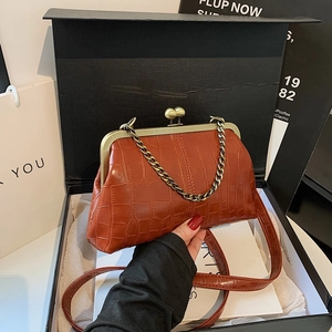 Elegant caramel crocodile pattern frame bag with bronze ball clasp and chain strap