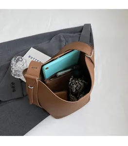 Top view of brown lychee grain leather bucket bag showing large interior storage space