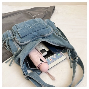 Spacious blue denim bag detail showcasing inner compartments for iPad and daily essentials