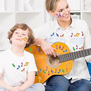 Colorful glitter music note stickers on guitar and skin for fun creative decoration