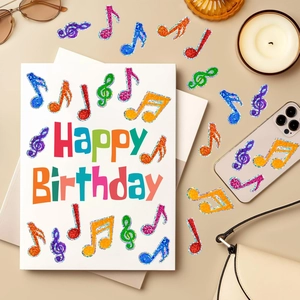 Glitter musical note stickers and Happy Birthday card with stylish decorative accessories