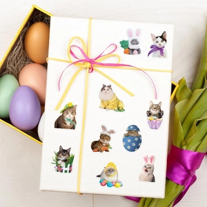 Set of 16 decorative Easter cat stickers featuring festive bunny ears and gift box scenery