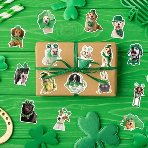 Close-up of cute St. Patrick's Day dog stickers on a kraft gift box and green wood