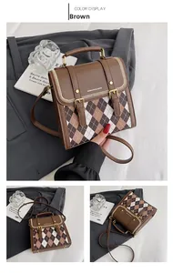 Detail of brown quilted patchwork crossbody bag featuring vintage style gold buckles