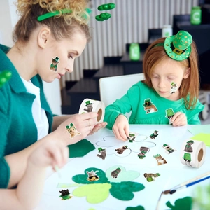 Close-up of cute St. Patrick's Day cat stickers used for DIY clover crafts and facial decor