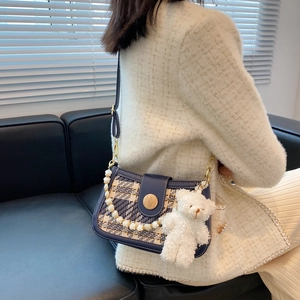 Vintage plaid crossbody bag with blue leather trim, bear charm and pearl chain detail