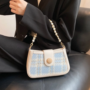 Blue plaid weave shoulder bag with white beaded strap and leather trim detail